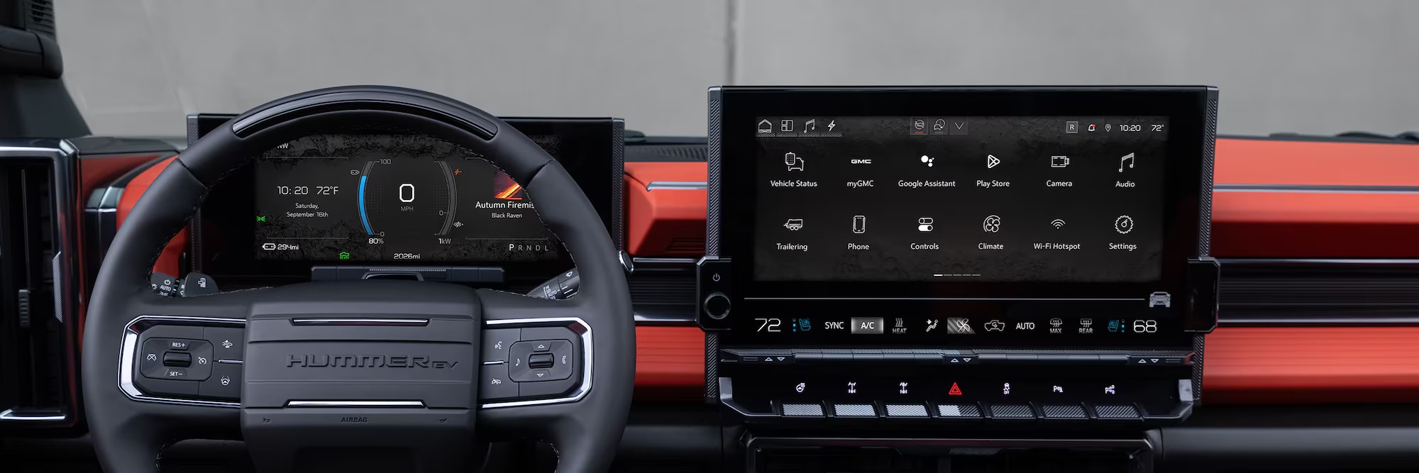 Steering wheel and infotainment system inside the 2026 GMC Hummer EV.
